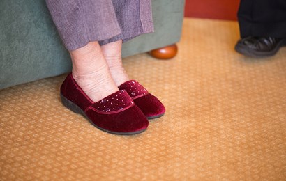 A pair of ladies red velvet slippers