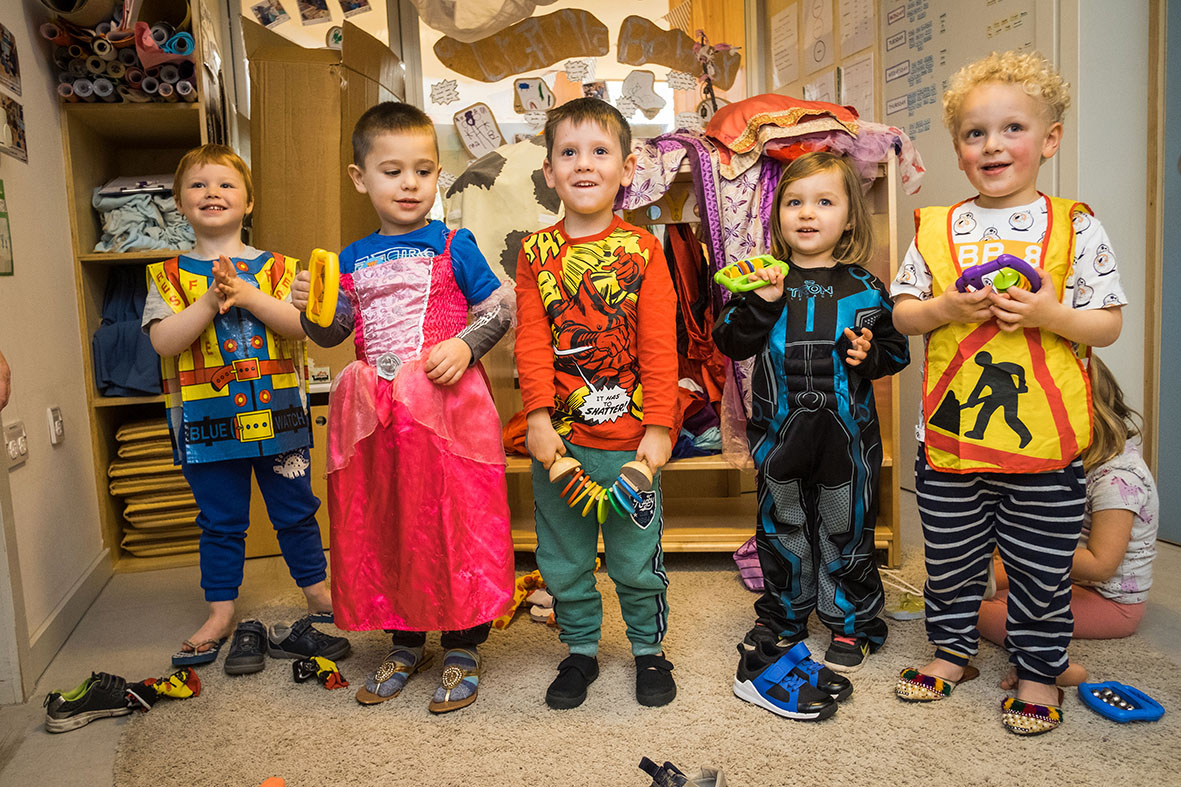 Group of children playing dress up