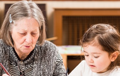 Older lady and young girl painting