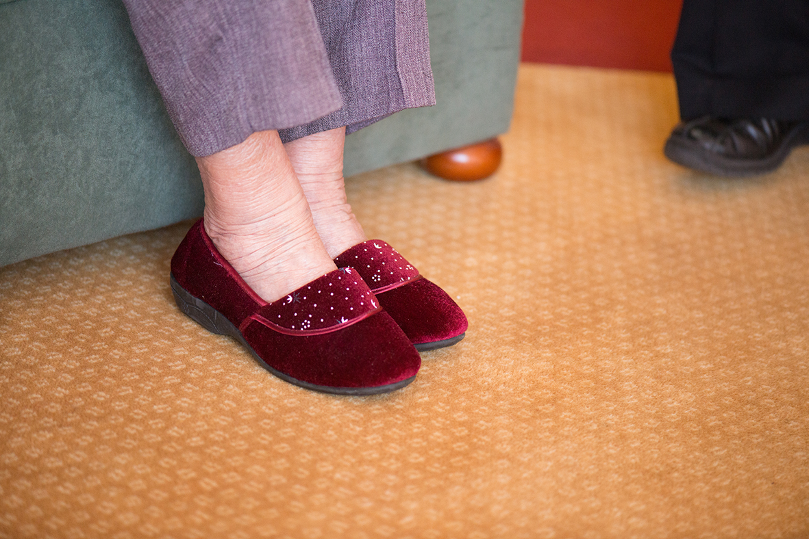 A pair of ladies red velvet slippers