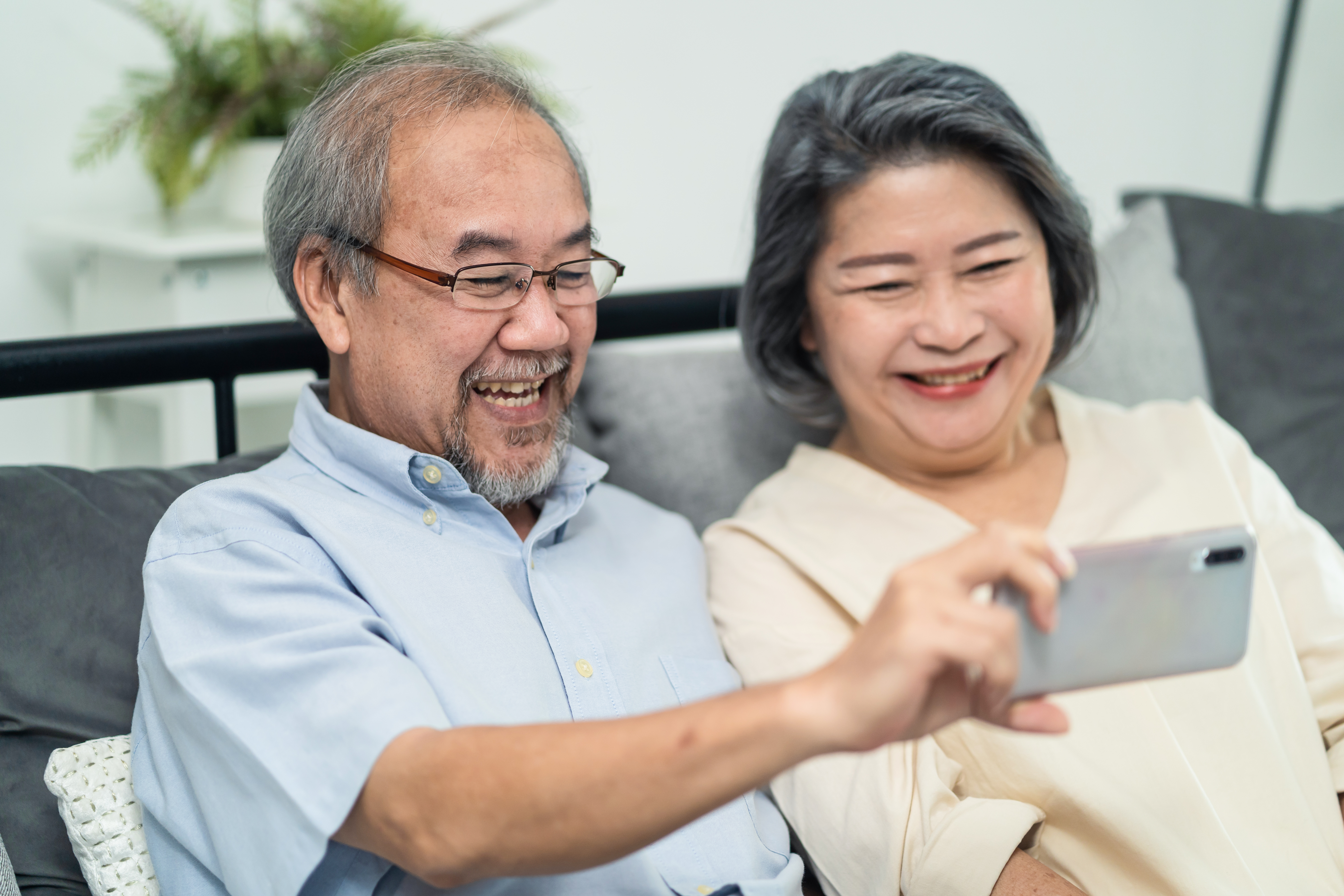 Couple watching a mobile phone screen