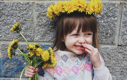 Little girl with dandelions